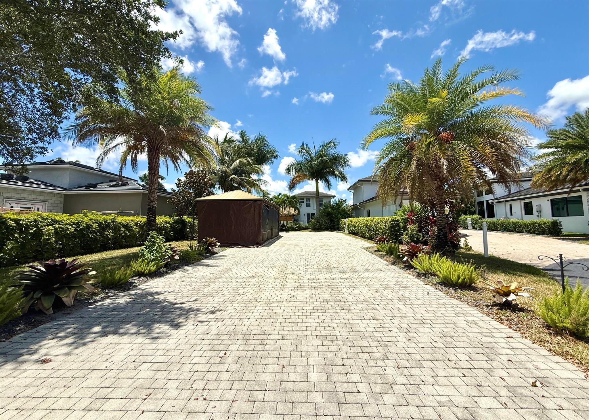 Live the ultimate South Florida lifestyle at Aztec RV Resort, an exclusive gated community perfectly located near Fort Lauderdale Airport, pristine beaches, and top-tier dining, shopping, and entertainment. This resort offers an upscale environment tailored for luxury Class A motor coach owners who value comfort, convenience, and a vibrant community.This premium 5,612 sq ft lot is one of the best in the entire resort. Designed to accommodate high-end Class A RVs, the property features a paved driveway and two 12x12 pergolas with metal roofs that are hurricane-proof. It comes turnkey, including stylish outdoor furniture, making it ideal for immediate personal use or as a smart, investor-friendly opportunity in a high-demand location.