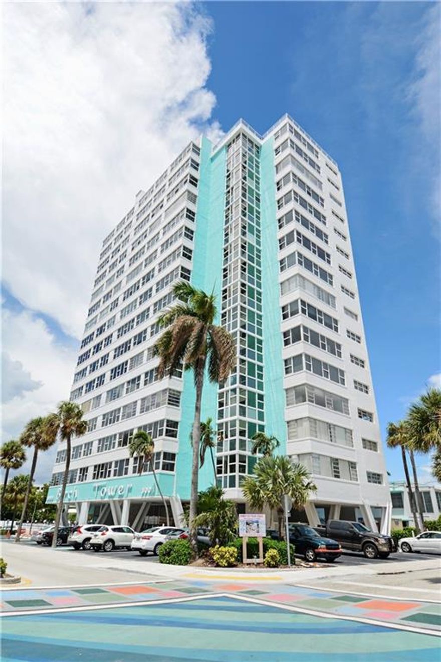 Large 1/1 with wall to wall impact windows for fantastic views; day and night.  Spacious with good closet space,   tiled floors, and a washer and dryer in the unit.  Rent includes AC, hot water, water and basic cable.  The complex has a large pool, exercise room and 24 hr security.  Only one block to the Beach, in the heart of North Beach Village.  Many restaurants near by....what a location!