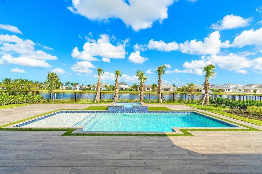 Breathtaking lakefront Toll Brothers home in the private gated community Watermark at Avenir! This 4 bedroom + an office 3.5 bath home features over 500k in upgrades! The large open floor plan with loads of natural light opens up to your private backyard oasis with an expansive backyard and custom heated pool and spa. The office as well as the huge master bedroom are on the first floor with a luxury bathroom featuring frameless glass shower with rainfall features and elegant free-standing tub and oversized walk-in closets. Gourmet kitchen features a large center island with breakfast bar, SS appliances, natural gas for cooking, plenty of counter and cabinet space and huge pantry. EV charger outlet in the 3 car garage. Impact windows throughout.