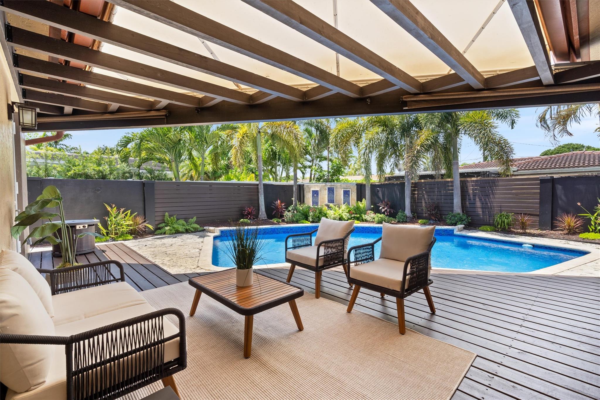 The best property to entertain in, move-in ready, and built to impress. This large Wilton Manors home checks every box: open layout, chef’s kitchen, soaring ceilings, impact windows and doors. Step outside to your private backyard oasis with fountains, pool, sun deck, and low maintenance landscaping. The spacious primary suite overlooks the pool and features a walk-in closet, double vanities, and oversized shower. Three more bedrooms, a walk-in pantry, full laundry room, and 2-car garage add serious functionality. Located in sought after East Wilton Manors just blocks from Wilton Drive and minutes to downtown and the beach. No HOA. Lucrative opportunity for investors looking to Airbnb.