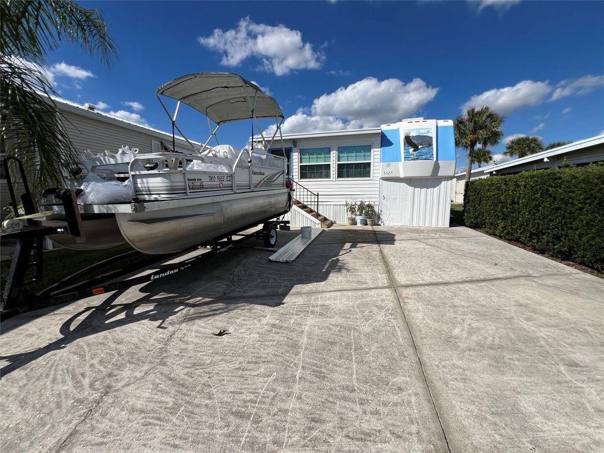 ~Ancient Oaks~ 55+ Community, Active Lifestyles- Fishing cabin- 5th Wheel with a huge FL room added. Double parking- bring the boat! Calling all fishermen.2 year old AC in 2023. Marina located in park with boat ramp & docks, fish cleaning station. Double Street. Plenty of parking!