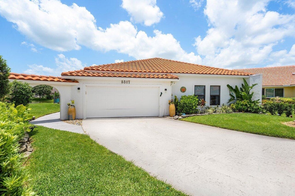 Photo of 8317 Bonita Isle Drive, Lake Worth, FL 33467 (MLS # R10903680)