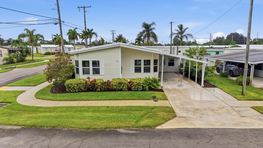 Welcome home to this beautifully updated, one-of-a-kind two-bedroom, two-bathroom corner lot residence in the low-HOA community of Tropical Breeze Estates.  From the moment you enter, you'll notice the meticulous attention to detail and thoughtful upgrades throughout. The home features all-new flooring, updated PEX plumbing, eight additional windows that flood the space with natural light, new siding, shutters, and doors, as well as a dehumidifier in both the main house and screened-in porch. A newer washer and dryer and updated appliances add everyday convenience.  The fully renovated kitchen is designed to impress, showcasing quartz countertops with abundant workspace, solid wood shaker cabinetry, stainless steel appliances, a dedicated pantry, oversized sink with instant hot water, and modern fixtures and hardware throughout.  The living and dining areas flow seamlessly from the kitchen, creating an open and inviting layout enhanced by updated fixtures, trim work, and natural light. The dining area also features built-in cabinetry for added style and storage.  The spacious primary suite offers wood-look vinyl flooring, vaulted ceilings, generous natural light, and a large walk-in closet. The en-suite bathroom includes a modern oversized vanity with solid wood cabinetry, updated fixtures, new mirrors and lighting, built-in storage, and a beautifully updated walk-in shower.  The secondary bedroom continues the same upgraded flooring and natural light, along with its own walk-in closet. The second bathroom has been tastefully updated with a modern vanity, vessel sink, solid wood cabinetry, and an oversized tub/shower combination with new hardware.  Enjoy year-round living in the fully enclosed Florida room, featuring tile flooring and walls of windows that create a bright, relaxing space. Just beyond, an additional enclosed patio and large flex room provide endless possibilities, perfect for a workshop, home gym, or extra storage.  The extremely low HOA fee includes full lawn care, irrigation, access to the community pool, recreational facilities, and shuffleboard. Conveniently located near the community entrance and just minutes from shopping, dining, major roadways, and beautiful South Florida beaches.