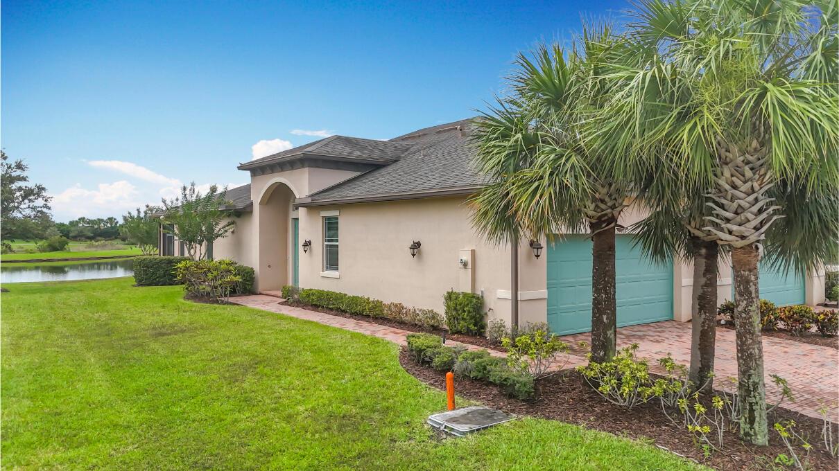 Wide water view! 2 bedroom PLUS den in the beautiful community of Lake Park in Tradition. Tray ceilings, granite counters, stainless steel appliances and 42'' cherrywood cabinets. Master bedroom with walk-in closet and master bath with dual granite sinks and large walk in shower. The lanai has one of the best views in the community with a wide view and no homes on the other side. Feel safe and secure during any storm with complete IMPACT GLASS all around. TWO community pools and clubhouses with tons of community events. HOA fee includes ALL lawn care, cable TV with HBO, high speed internet, monitored security alarm, phone land line and more! Don't miss your chance to own a little piece of Florida paradise!