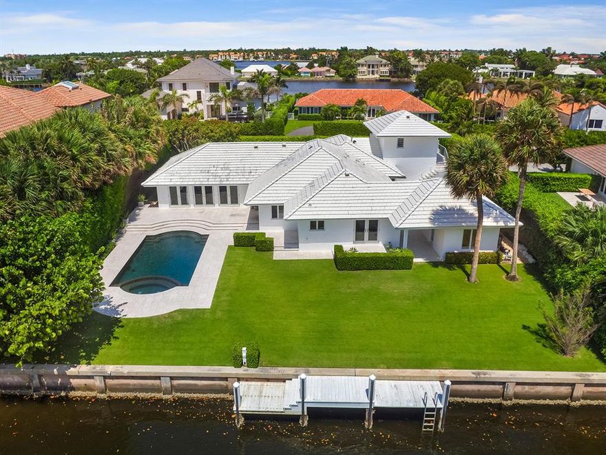 Step inside this stunning renovation of a waterfront home in Manalapan. Situated on this very quiet road that feels almost private with over 100 feet of water-frontage and direct ocean access only a few minutes boat ride away. Enjoy an open floor plan from this one story home with great ceiling height throughout. Three bedrooms, three and a half baths with a two car garage make up the main part of the house with a guest apartment over the garage. There is also a cabana/bedroom in a separate structure leading to the garden. French doors lead to a spectacular pool and private dock for some afternoon fishing/boating. Enjoy ocean breezes with complete privacy from mature manicured landscaping. This property also has private beach access and membership to La Coquille Club at the Eau Palm Resort