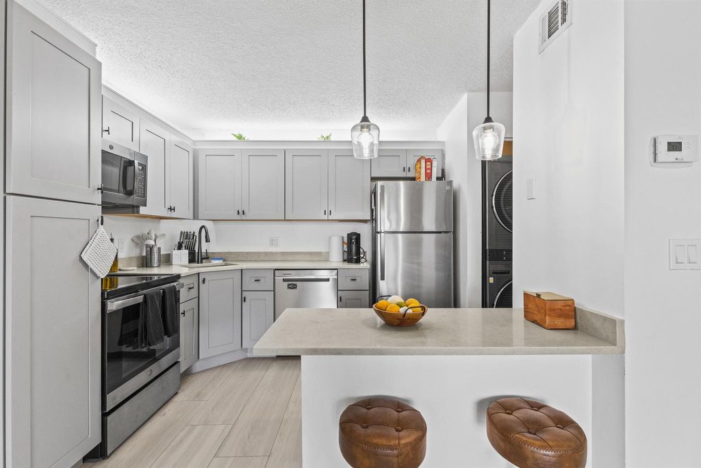 Photo of 603 Sea Pine Way #F1, Greenacres, FL 33415 (MLS # R11118436)