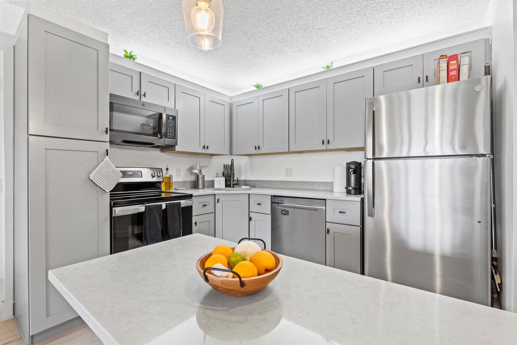 Photo of 603 Sea Pine Way #F1, Greenacres, FL 33415 (MLS # R11118436)