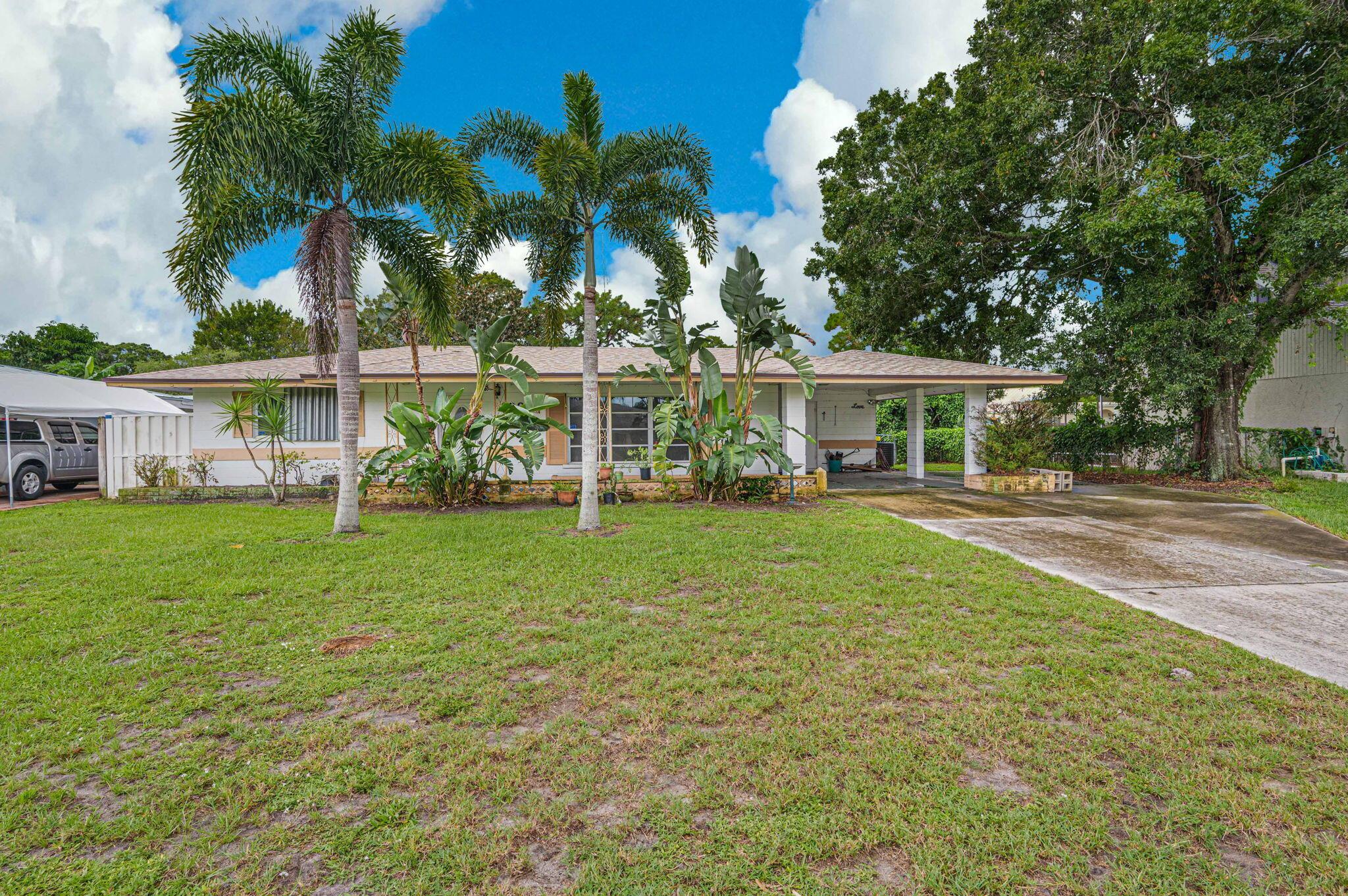 Welcome Home to your own piece of Paradise. This Spacious Two Bedroom, One and Half Bath with a Bonus Room, which could be used for an Office or Extra Bedroom. This home was built to last with CBS Construction and a New Roof 2024. Home features Terrazzo floors in the Living room and New carpet in Bedrooms. This is a great location close to Beautiful beaches, shopping, Schools, Hospital and Downtown.