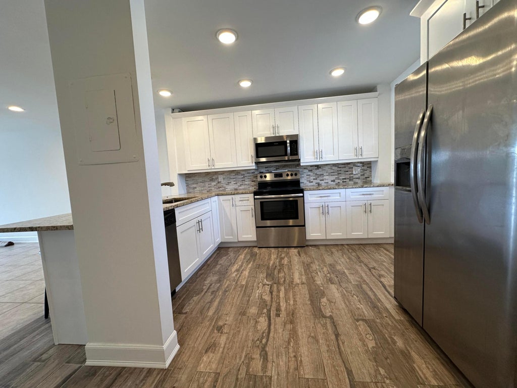 Photo of 309 Lake Circle #202, North Palm Beach, FL 33408 (MLS # B26078126)