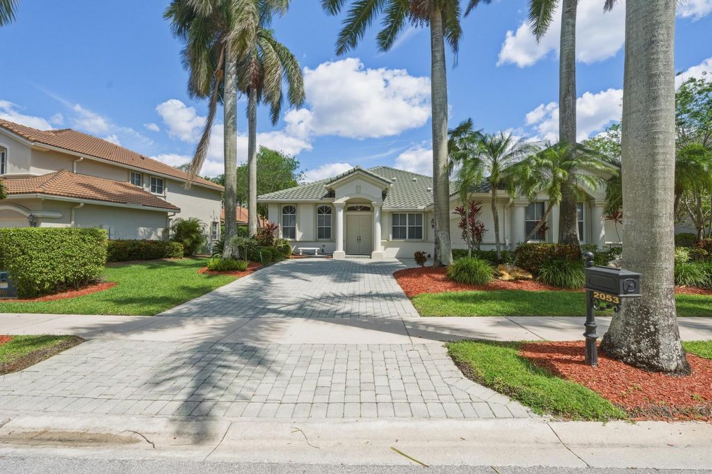 Photo of 2053 Quail Roost Drive, Weston, FL 33327 (MLS # B26019340)