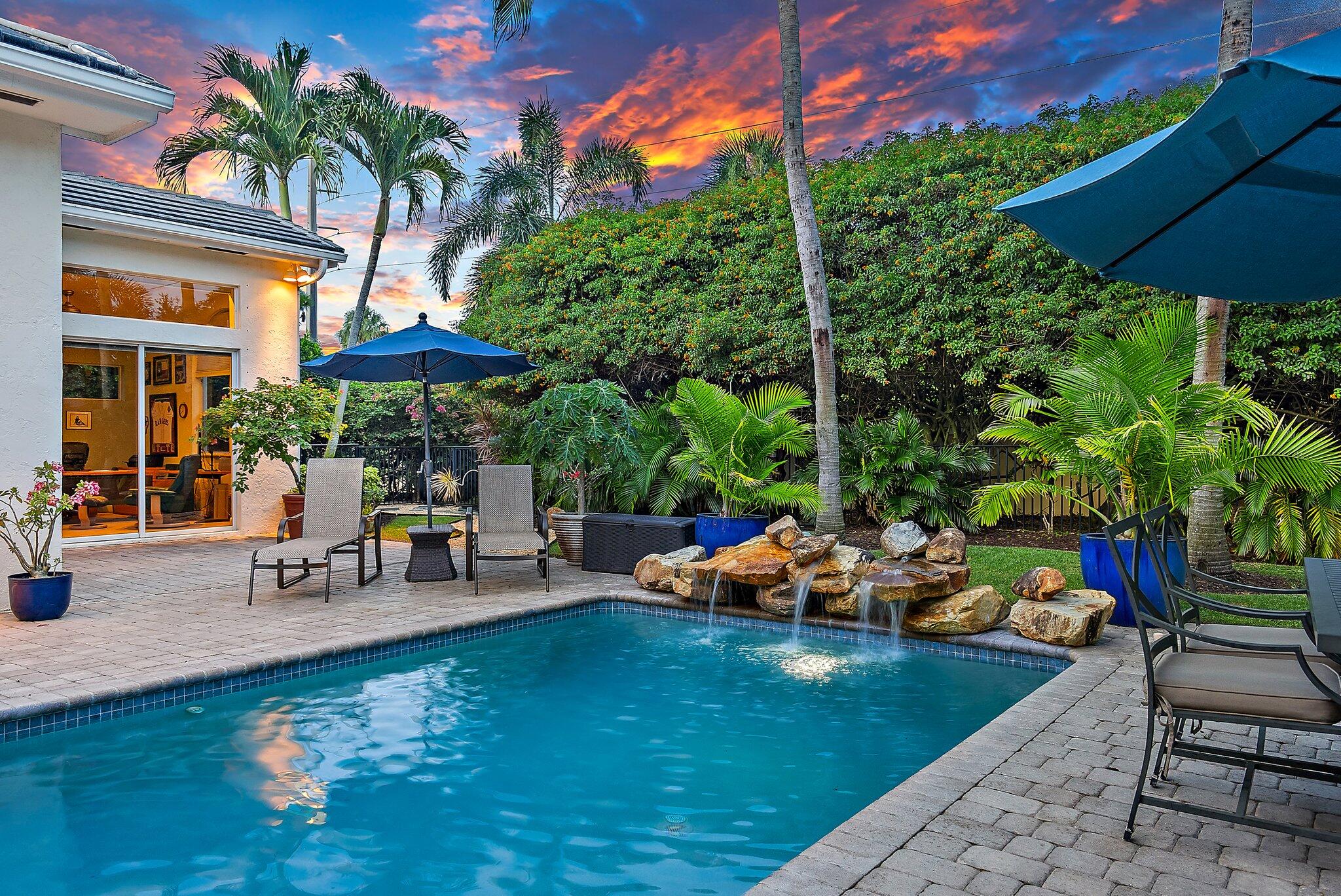 Nestled within the hidden gem of Shady Lakes, this spacious 5 bedroom, single-story CBS home is situated on a quiet cul-de-sac with lush landscaping and a spectacular backyard oasis with a solar-heated pool. Along with an updated kitchen, new HVAC system, tankless water heater, and flat concrete tile roof, you'll enjoy open living spaces and an abundance of natural light. The home additionally features a split bedroom floor plan, high ceilings, dedicated laundry, and two-car garage. The Shady Lakes community is a well-established low cost HOA within a stone's throw of The Gardens North County District Park, Palm Beach Gardens Tennis and Pickleball Center, and top-rated schools. Take advantage of excellent proximity to the best shopping, dining, and recreation in the Northern Palm Beaches.