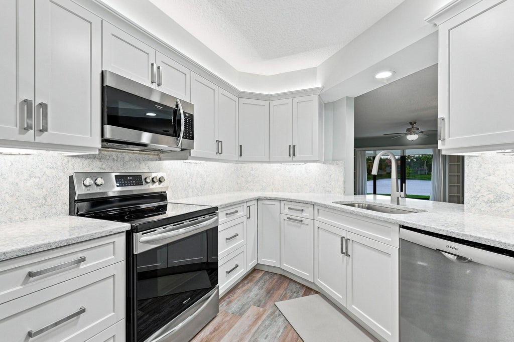 Photo of 3410 SE MARTINIQUE Trace #102, Stuart, FL 34997 (MLS # B26069100)