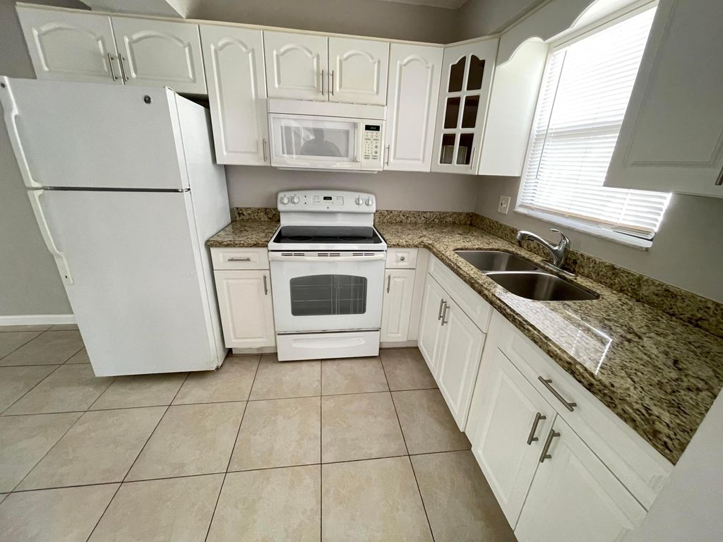 Photo of 5806 Channel Drive, Greenacres, FL 33463 (MLS # R11003493)