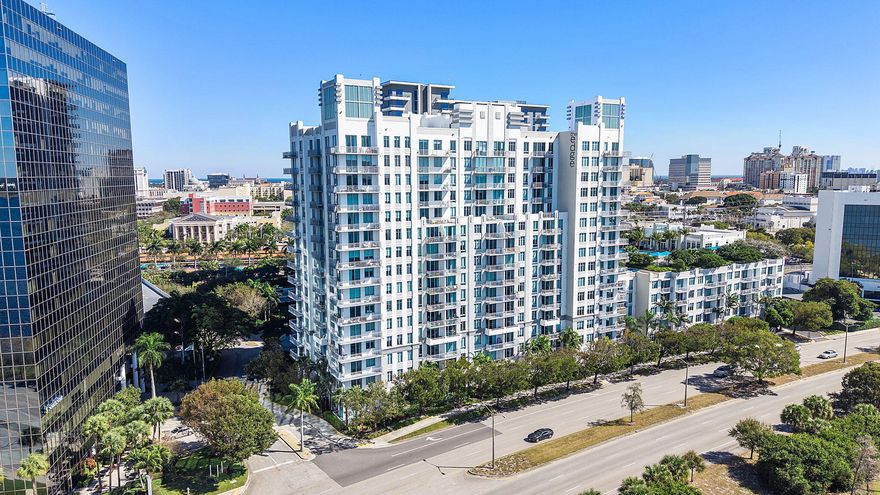 Discover the height of urban coastal elegance in this breathtaking high-rise residence, which boasts spectacular views of the Intracoastal Waterway and the city skyline. This meticulously maintained home combines style and functionality, featuring impressive floor-to-ceiling windows, stylish wide-plank flooring, and a spacious private balcony that overlooks a tropical resort-style oasis.