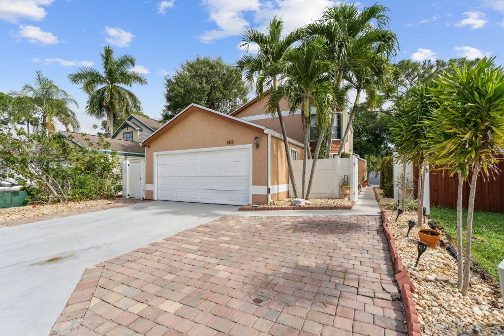Photo of 1412 Apple Blossom Lane, West Palm Beach, FL 33415 (MLS # R11051651)
