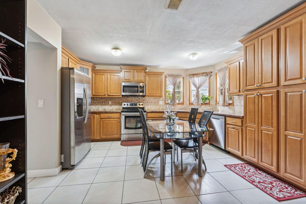 Photo of 1412 Apple Blossom Lane, West Palm Beach, FL 33415 (MLS # R11051651)