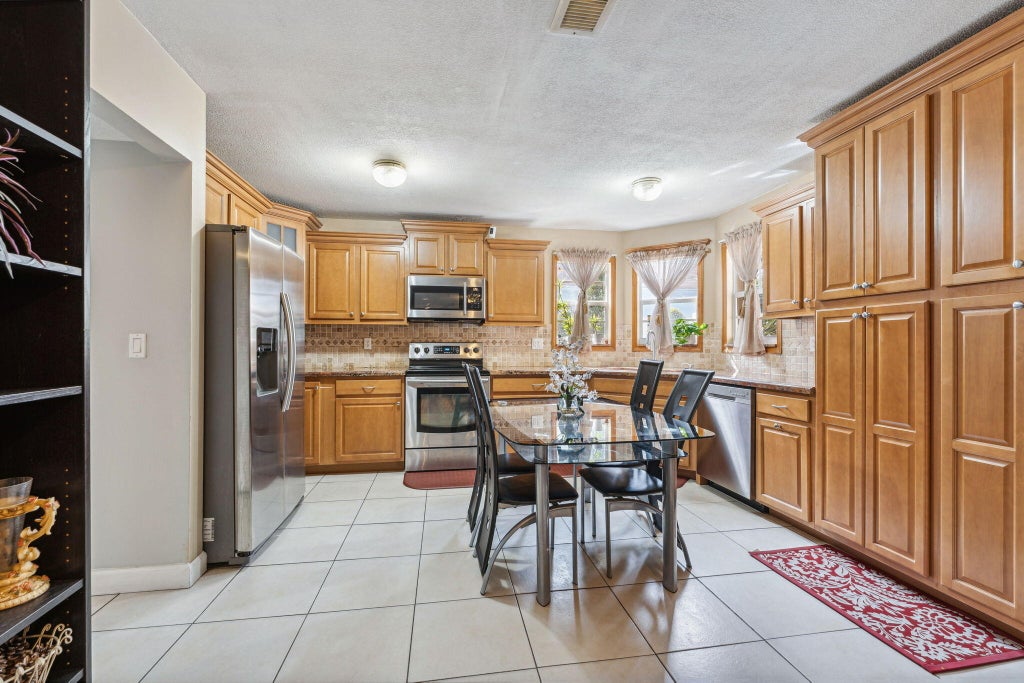 Photo of 1412 Apple Blossom Lane, West Palm Beach, FL 33415 (MLS # R11051651)