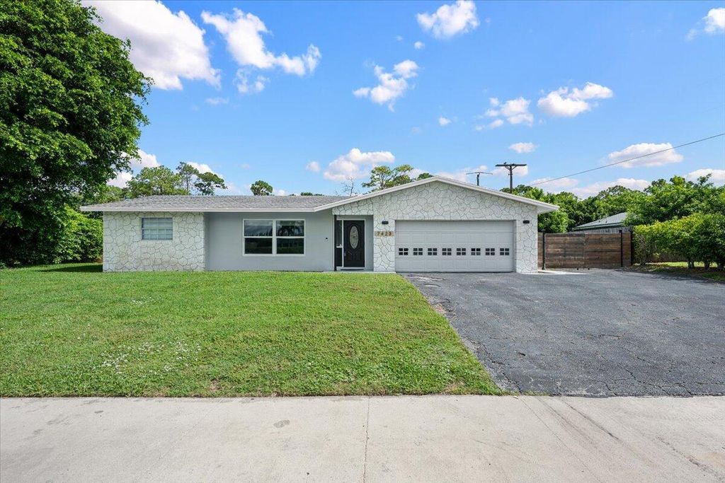 Photo of 7423 Oakmont Drive, Greenacres, FL 33467 (MLS # B26047092)