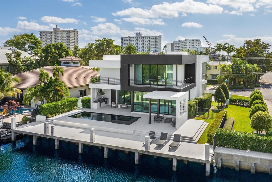 Indulge in the epitome of waterfront luxury living with this new, contemporary, gated Estate nestled in the prestigious security-patrolled neighborhood of Seven Isles. Recently built in 2019, this sleek, modern estate designed by renowned Architect Bruce Celinkski will captivate you. Upon entry find a chef's kitchen equipped with top-of-the-line Miele appliances, a downstairs guest suite, & an elevator. The expansive primary suite is a true sanctuary with dual walk-in closets, spa-like bathroom with dual water closets & a private balcony for relaxing. Outside find a heated salt system pool w spa, summer kitchen & cabana bath, perfect for the avid entertainer. Close proximity to the ocean via boat & close to the beach and Las Olas shopping & fine dining.
