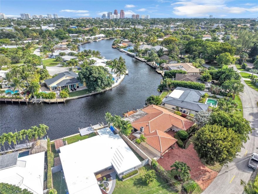 Beautiful 3BD/2BA waterfront home in highly desired Wilton Manors! Enjoy over 70 feet of serene water frontage on the North Fork of the Middle River—perfect for paddleboarding and kayaking, personal watercraft and small boat. This home features elegant marble floors, an oversized primary suite with gorgeous water views, and a spacious walk-in closet. The open living spaces flow seamlessly to the outdoors, where you'll find a large wood deck overlooking the waterway and a stainless steel BBQ grill ideal for entertaining. Additional highlights include impact windows, generator hookup, an oversized 2-car garage, and a large brick circular driveway offering ample parking. Just minutes beautiful beaches, Wilton Drive, shopping, and dining—experience true South Florida waterfront living!