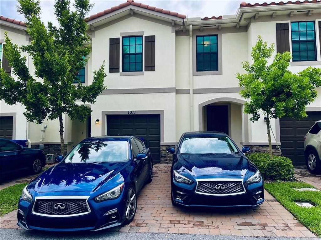 Photo of 1011 Kapok Ln, Riviera Beach, FL 33410 (MLS # F10383702)