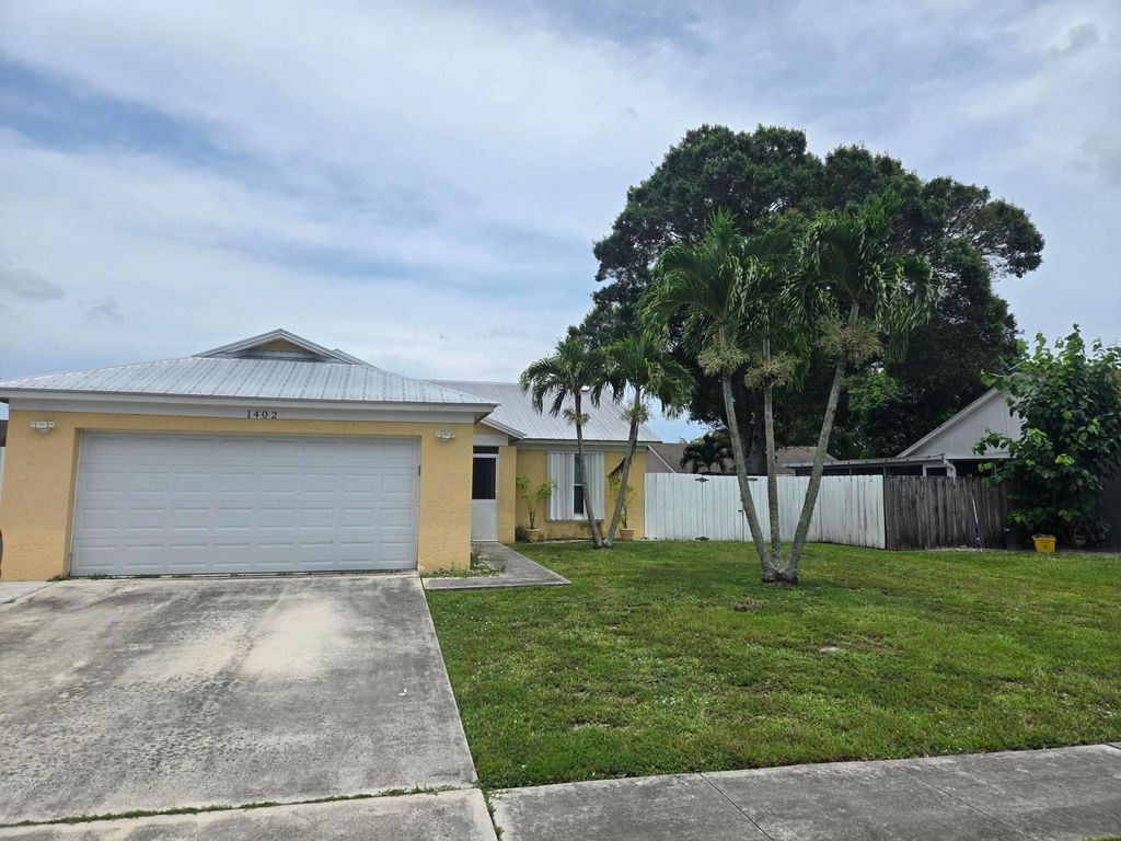 Photo of 1402 Denlow Lane, Royal Palm Beach, FL 33411 (MLS # B26042965)