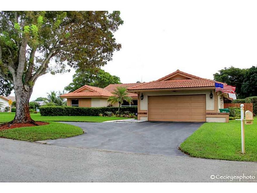 Transfer forces sale.  Lovely home on corner fenced  lot with pool under screened enclosure.  Renovated kitchen with granite and stainless steel appliances. Guest bath and half bath have been renovated.  White tile and wood laminate floors in bedroom.  Ne w water heater and alarm system.  Roof and HVAC have been upgraded.  Hurricane impact windows on most windows.  Built it book shelves.  Light, bright and open floor plan.  Very popular neighborhood with great schools.  Minutes to shopping, dining& beaches