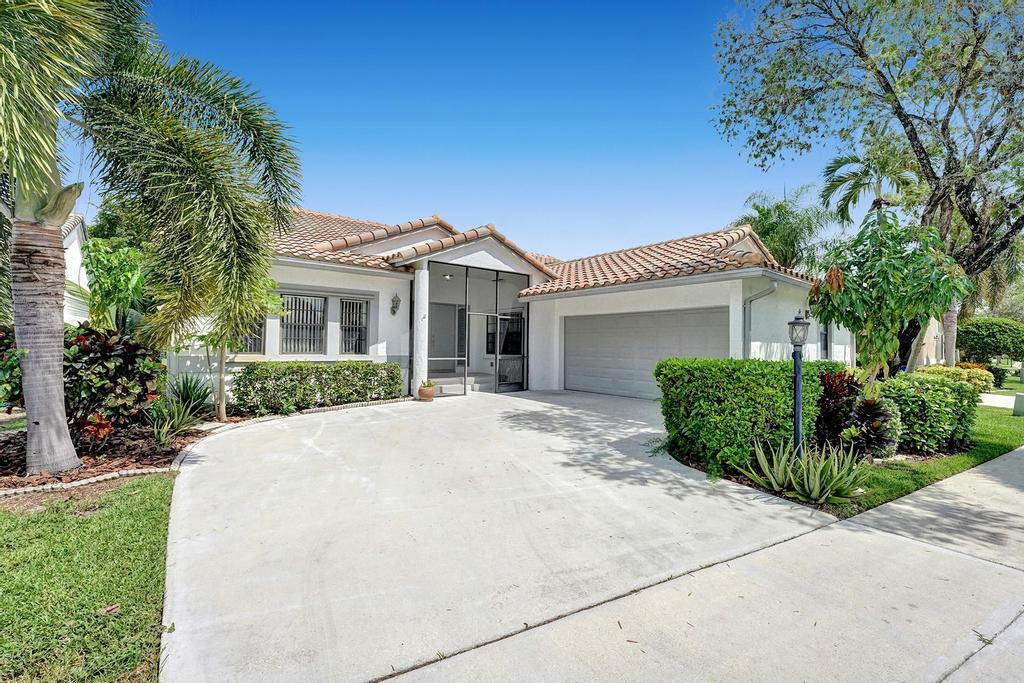 Large 3 bedroom 2 bath single story home with stunning golf course views in the heart of Boca Raton. This home features an open floor plan with high volume vaulted ceilings, 2 car garage, and large screened in patio area overlooking the golf course. Brand new A/c unit, Refrigerator and washer. Located in Wedgewood which is a small, all ages, gated community featuring a community pool, tennis courts, and playground area for kids.