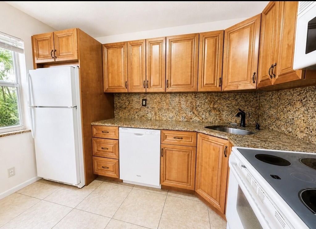 Photo of 25 Colonial Club Drive #101, Boynton Beach, FL 33435 (MLS # B26024808)