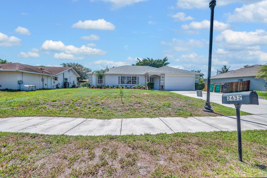 Photo of 2432 SE Floresta Drive, Port Saint Lucie, FL 34984 (MLS # R11102901)