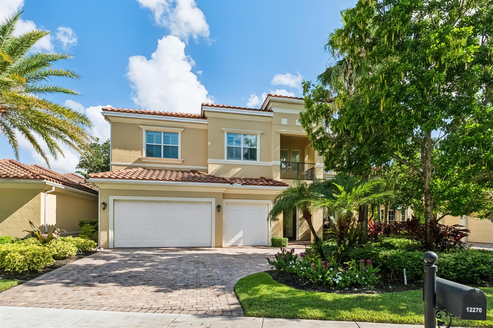 This stunning home is located in the coveted neighborhood of Hunter's Chase within the Palm Beach Polo Club. Featuring a total of 4,300 square feet under air, this waterfront property offers 6 bedrooms, 4 full and 1 half baths, a 3-car garage, and boasts lake and golf course views! Curated with designer touches throughout the two stories, the interior boasts vaulted ceilings, stunning dark wood floors, an eat-in kitchen with a wet bar plus a formal dining room, family room, and a luxurious master suite with its own private patio. Step outside to enjoy the spacious enclosed patio, featuring a summer kitchen plus a stacking glass door system for instant outdoor living. The perfectly manicured backyard is equipped with a large Travertine tile deck, freeform pool, and expansive fenced yard.