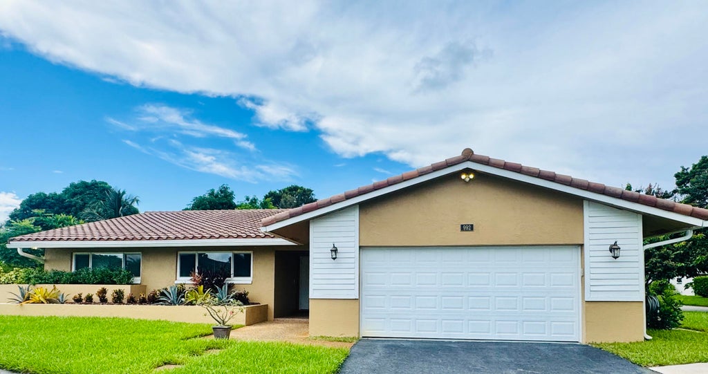 Photo of 992 NW 83RD Drive, Coral Springs, FL 33071 (MLS # B26078552)