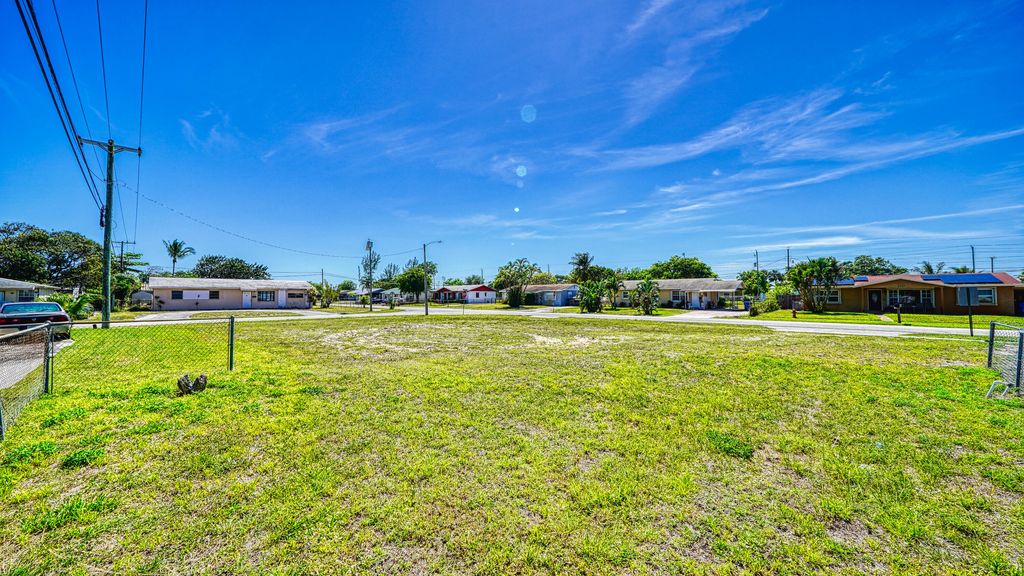 Photo of 398 W 23rd Street, Riviera Beach, FL 33404 (MLS # R11166382)
