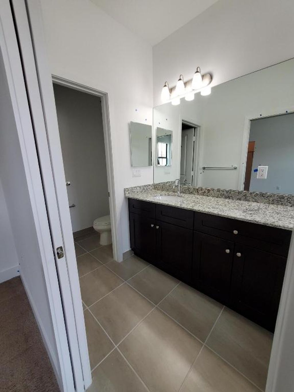 Photo of 2022 S Oysterwood Lane S, Riviera Beach, FL 33410 (MLS # R11114108)