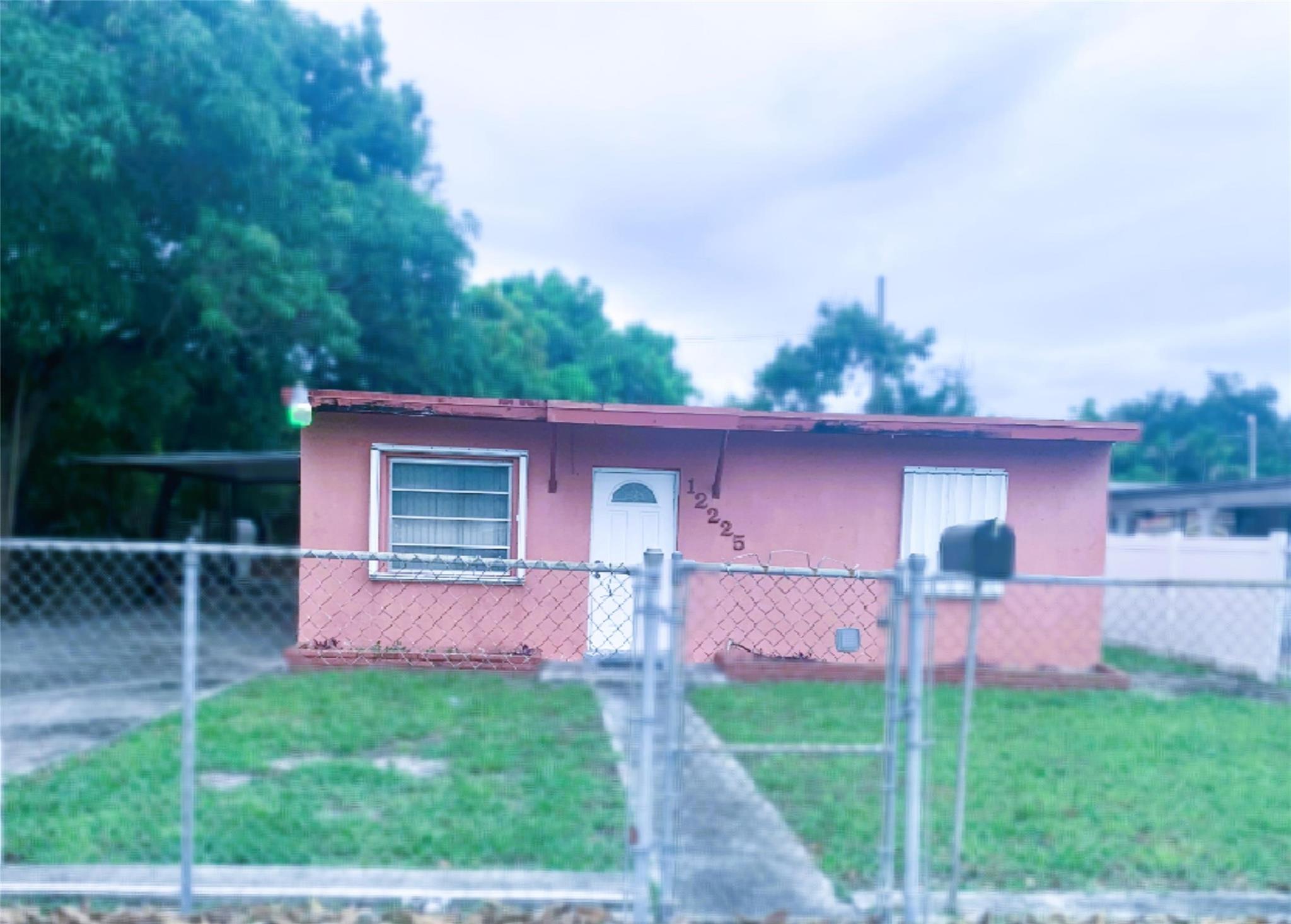 This is a diamond in the rough. It is being sold absolutely As Is. There is a great size lot, and the ability to really get into a home at an affordable price. It does need work. New central A/C units in 2018. Could be a great starter or investment property. Bring some vision, with a modest budget and creativity this place can be a great home. Automatic gate is fully functioning. Actual photos are included along with a series of AI generated staged shots which shot with a little bit of work this home will come alive. This is a great opportunity for a reasonably priced starter home with as a residence or an investment property.