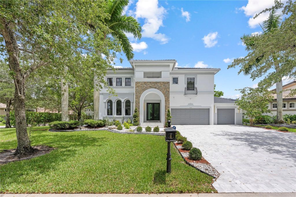Photo of 7582 NW 127th Manor, Parkland, FL 33076 (MLS # F10507189)