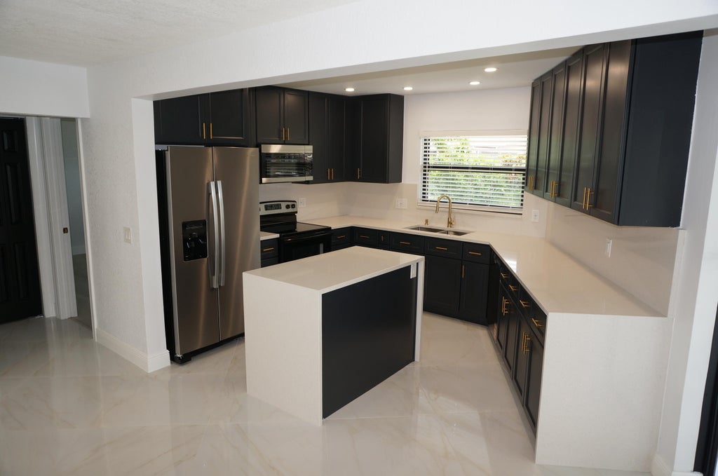 Photo of 1513 39TH Street, West Palm Beach, FL 33407 (MLS # B26072600)