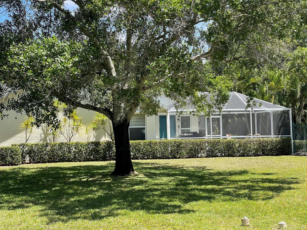 Photo of 402 SW Thistle Trail, Port Saint Lucie, FL 34953 (MLS # R10979747)