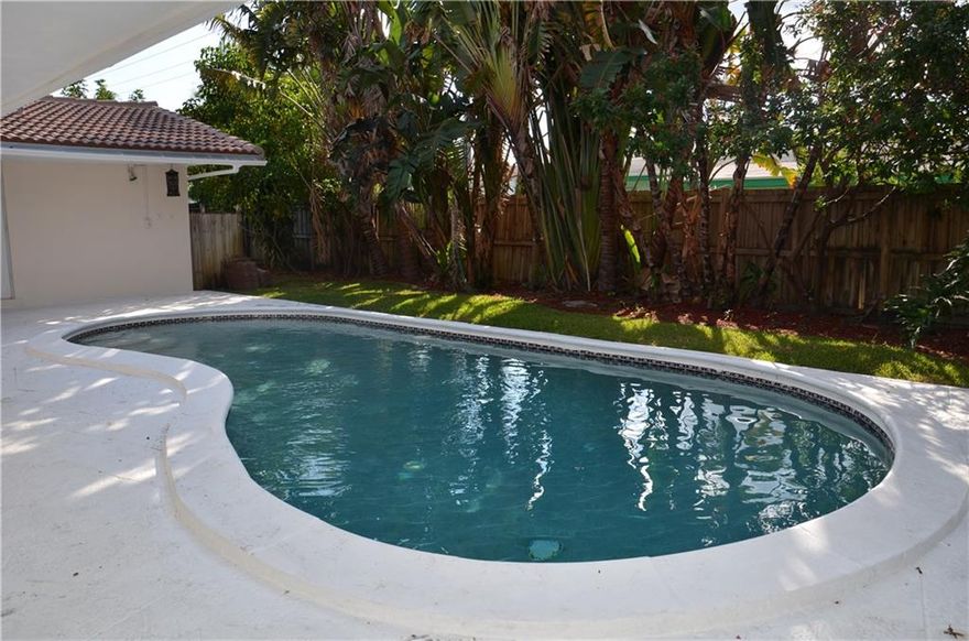 Fabulous 3/2 pool home with lots of natural light throughout! Diagonal tile floors, remodeled eat in kitchen/stainless appliances. Remodeled main bath. Entertainer's living/dining room-full sliders leading to private pool & patio! Master bedroom overlooking lagoon pool-huge walk in closet & large master bath. New tile roof-approx. 2 yrs. New AC-6 months. Tented termites 2013. Hurricane shutters. Oversized 1.5 garage. Private backyard-lush tropical landscape with pool & patio.