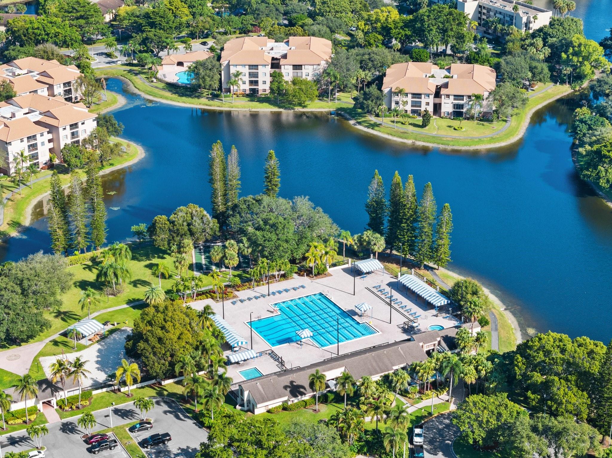 **SELLER IS VERY MOTIVATED BRING OFFERS**Located in Baywood Village II on the FIRST FLOOR, 2 bedroom 2 bath corner unit & steps to your parking spot. Features include an updated Kitchen & stainless steel appliances. Neutral tile in living areas and wood laminate flooring in bedrooms. Living room and separate dining area. Split bedroom plan. Primary bedroom with walk-in closet. AC 2017 & ROOF DONE 2020. Oversized enclosed patio that can be used as den or patio. Community pool and Township amenities included with fitness center, Theater, walking paths, tennis, basketball, volleyball, pickelball courts, olympic style pool and so much more!
