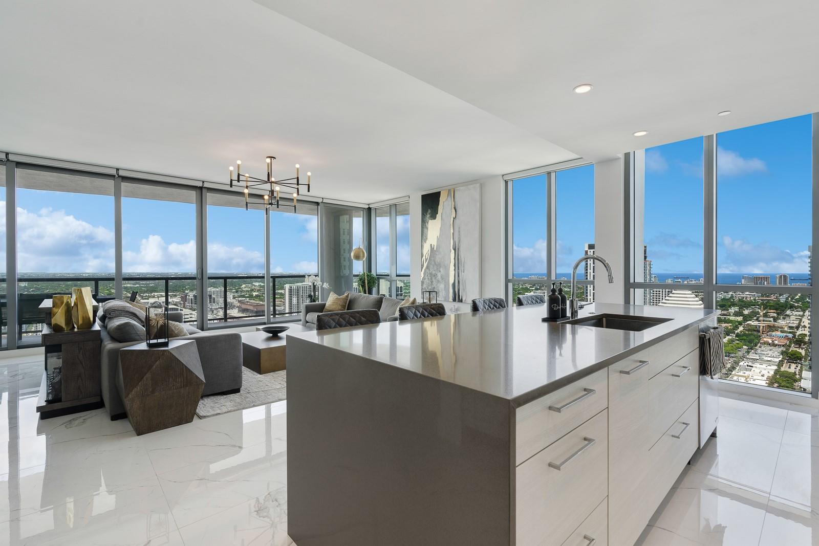 Soaring 40 stories above the city center, this exclusive residence is one of only six in the estate collection—offering unmatched privacy, sophistication, and breathtaking views of Fort Lauderdale's skyline. Floor-to-ceiling windows frame the cityscape, while a private elevator entrance and access-controlled entry points provide discreet, secure access. This expansive 4-bedroom, 4.5-bath layout includes a formal dining room, family room, and a theatre room. Designed for both comfort and elegance, the home features premium flooring, European kitchen cabinetry, quartz countertops, high-end fixtures, and private terraces with glass railings—perfectly positioned for uninterrupted views and seamless indoor-outdoor living and entertainment.
