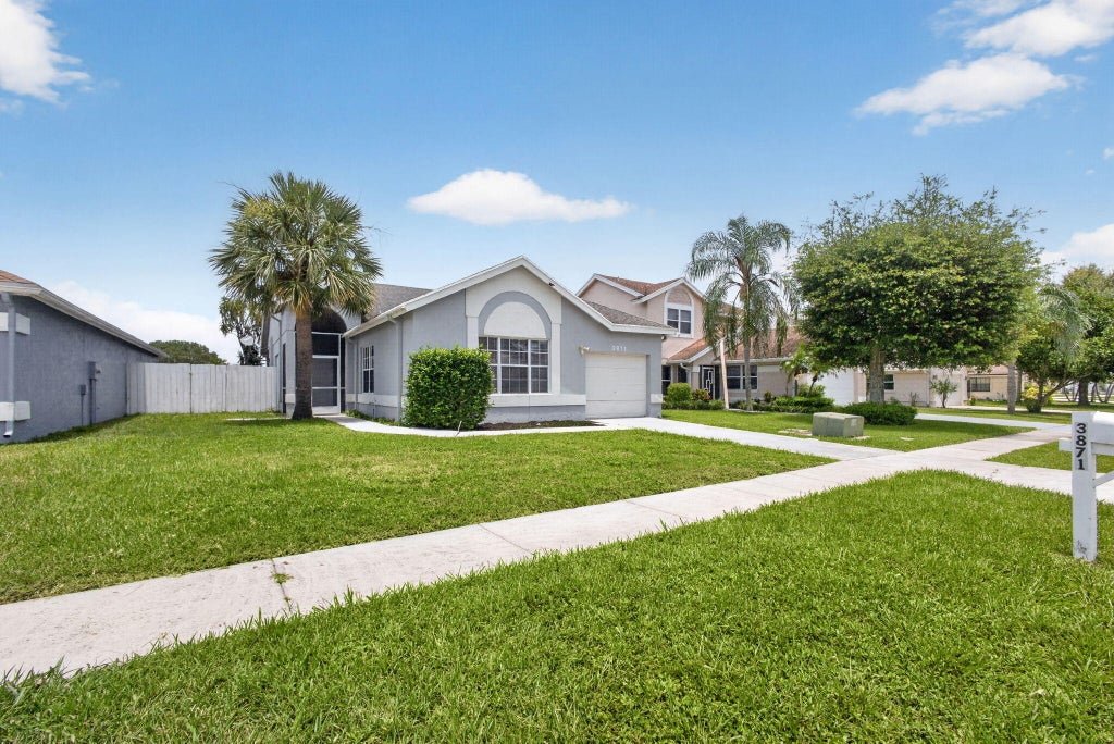 Photo of 3871 Circle Lake Drive, West Palm Beach, FL 33417 (MLS # B26053659)