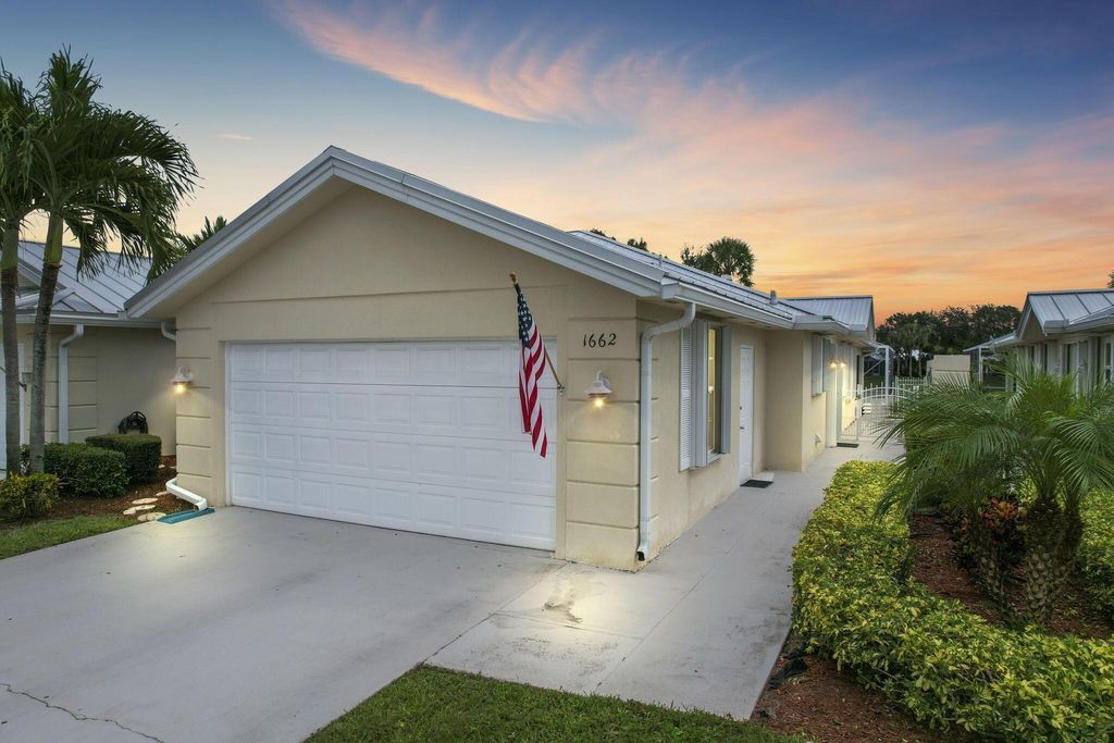Photo of 1662 SW Waterfall Boulevard, Palm City, FL 34990 (MLS # R10926749)