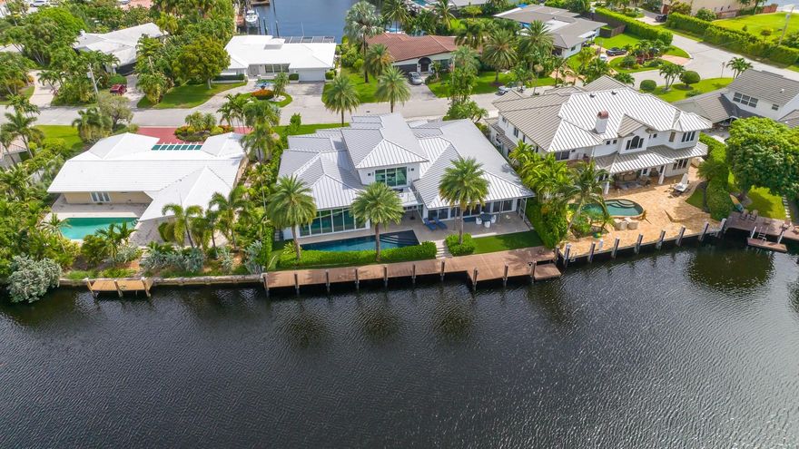 Welcome to the Landings a True boater's community. Built in 2014 & designed by Robert Tuthill. This Contemporary Waterfront 4 bed 4.5 bath 3-car garage pool home features the ultimate Open floor plan w/ 12-20ft ceilings. Split bedrooms, large master w/ spectacular water views. Home Situated on a wide water way w/ 102ft of dockage, one inlet from the intracoastal. Home has high energy efficient impact windows & doors, two 5 ton 18 seer ac units, Iclyene foam insulation in the attic, aluminum roof, 2 gas tankless hot water heaters, engineered wood flooring. Kitchen features Miele appliances, European cabinetry, induction cooktop w/gas burner, Double refrigerator & freezer, steamer, wine cooler, wet bar with kitchen Island that seats six, Experience indoor outdoor living at it's Finest !!!