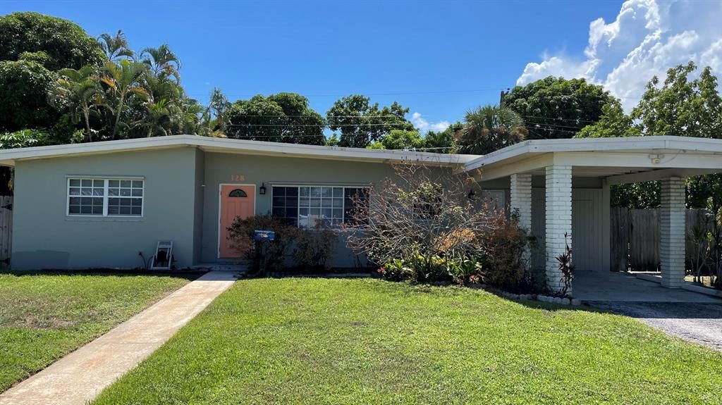 Photo of 328 E Jasmine Drive Dr, Lake Park, FL 33403 (MLS # R10834020)