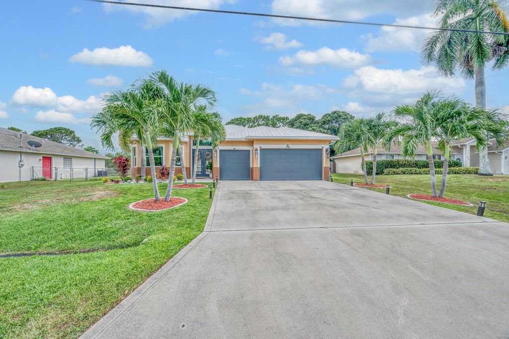 Photo of 2082 SW Idaho Lane, Port Saint Lucie, FL 34953 (MLS # R11114520)