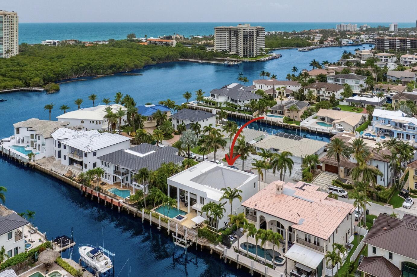 Experience the pinnacle of South Florida living in this fully furnished, turnkey modern estate located just two lots from the point on a deep-water canal with 85 feet of dockage--perfect for boating enthusiasts with direct Intracoastal and ocean access.This two-story residence showcases striking architectural lines, dramatic columns, and expansive glass walls that flood the interiors with natural light. Inside, enjoy soaring ceilings, designer lighting, curated furnishings, and an open-concept layout that seamlessly integrates formal living, dining, and entertaining spaces. A floating staircase and glass-enclosed loft areas enhance the home's sense of scale and modern elegance.