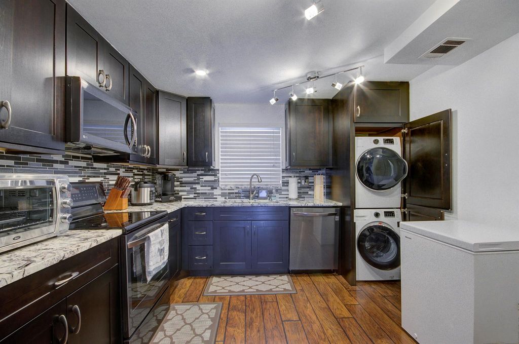 Photo of 3040 Lake Shore Drive #502, Riviera Beach, FL 33404 (MLS # R11134911)