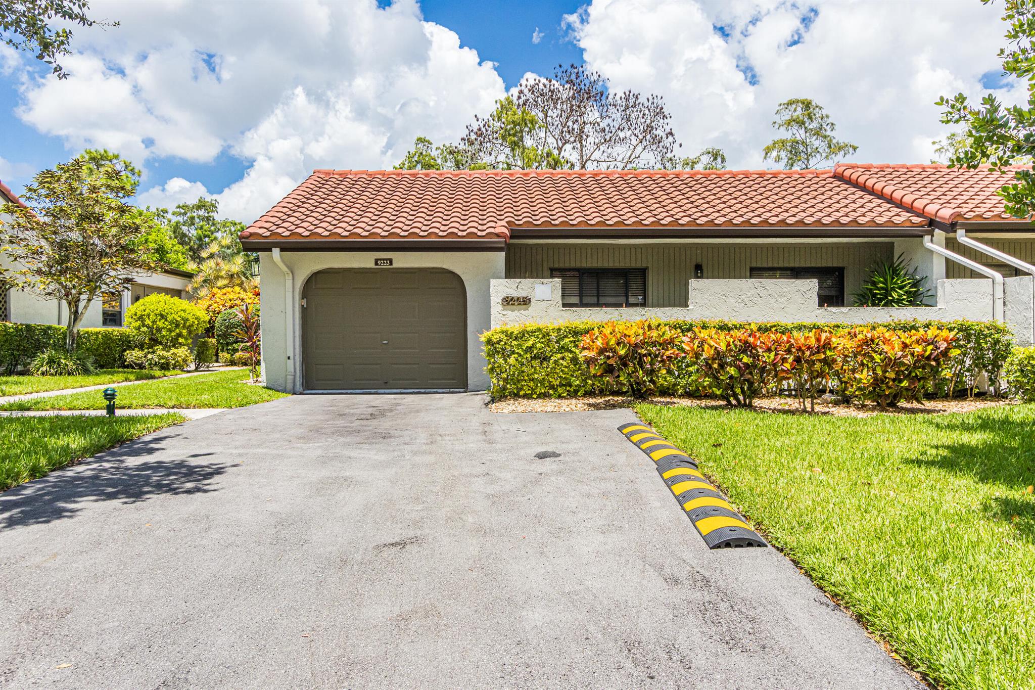 Stunning upgraded villa with Newer roofs ,brand new AC and and newly expanded driveway. The villa boasts beautiful open concept starting with new kitchen that has an upgraded appliance package, large kitchen island with quartz countertops and extra storage. Enjoy all the Large living areas with high vaulted ceilings which leads into the enclosed den with full panoramic view ofgolf course. Bathrooms are remodeled with gorgeous free standing tub in master bath with separate shower. Second bath has new shower. Enjoy an expansive golf course view from your patio. In the front, you can enjoy your beautiful patio off the 2nd and 3rd bedroom. You also have a full 1 car garage. Boca Lago is a 55 plus community. Cypresses offers its own clubhouse with a pool Don't miss it