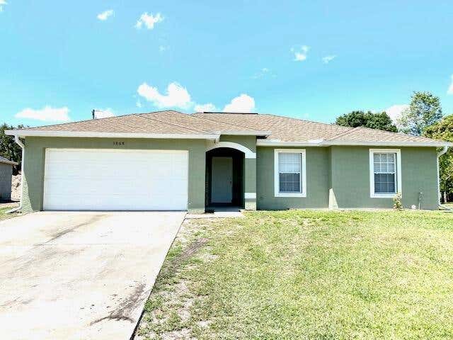 Photo of 3868 SW Jacobs Street, Port Saint Lucie, FL 34953 (MLS # R10712073)